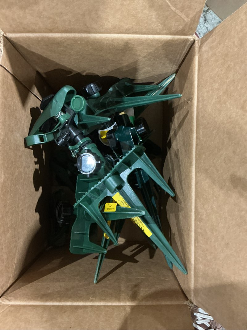 Condition photo showing As Is for assorted of impulse spike lawn sprinkler