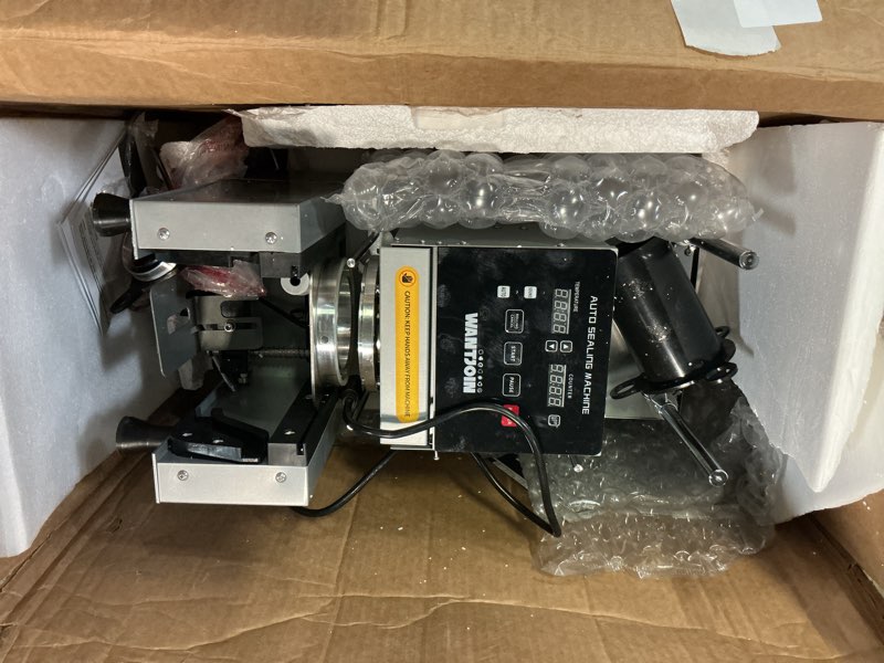 Condition photo showing As Is for WantJoin Cup Sealing Machine - Full Automatic Cup Sealer Machine 90/95mm, 35.4/37.4in, 500-650 Cups/H Commercial Digital Control LCD Panel Electric Cup Sealer for Bubble, Milk Tea, Coffee, Grey Sliver 24.8"L x 18.5"W x 12.99"H