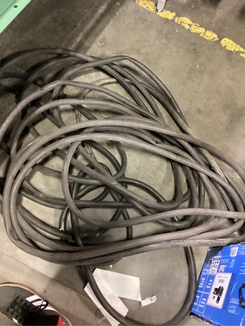 Condition photo showing As Is for 100ft black hose