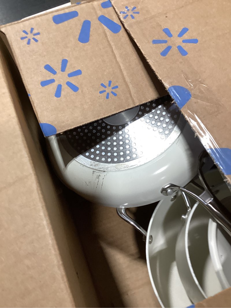 Condition photo showing As Is for amazon basics ceramic nonstick cookware, 8-piece set of pots and pans, dishwasher and oven-safe, all cooktop induction friendly, ivory