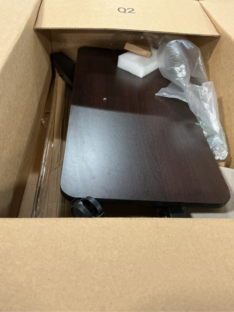 Condition photo showing As Is for drive medical overbed table with wheels - secure height adjustment for comfort - non tilt surface - smooth rolling design - home & hospital use - woodgrain laminate top - silver vein silver vein table