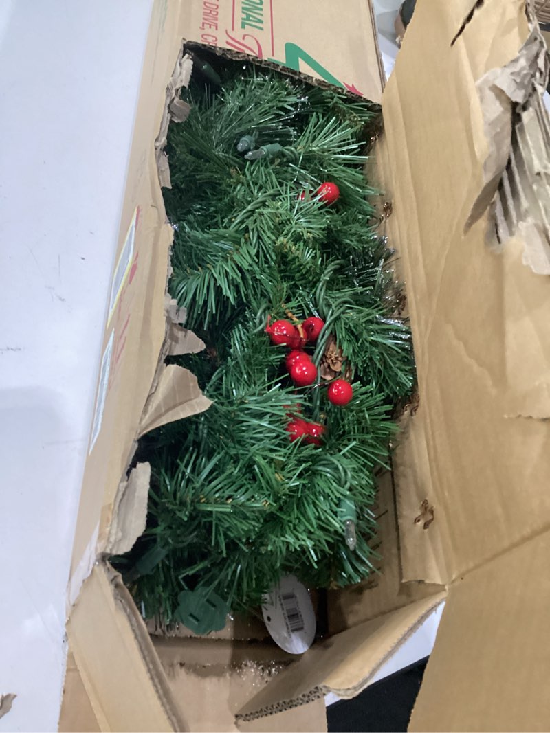 Condition photo showing Good Condition for national tree company 9 ft pre-lit crestwood spruce artificial christmas garland, christmas decoration with glitter, pinecones, red berries, 50 clear lights, 180 tips, green plug in tree
