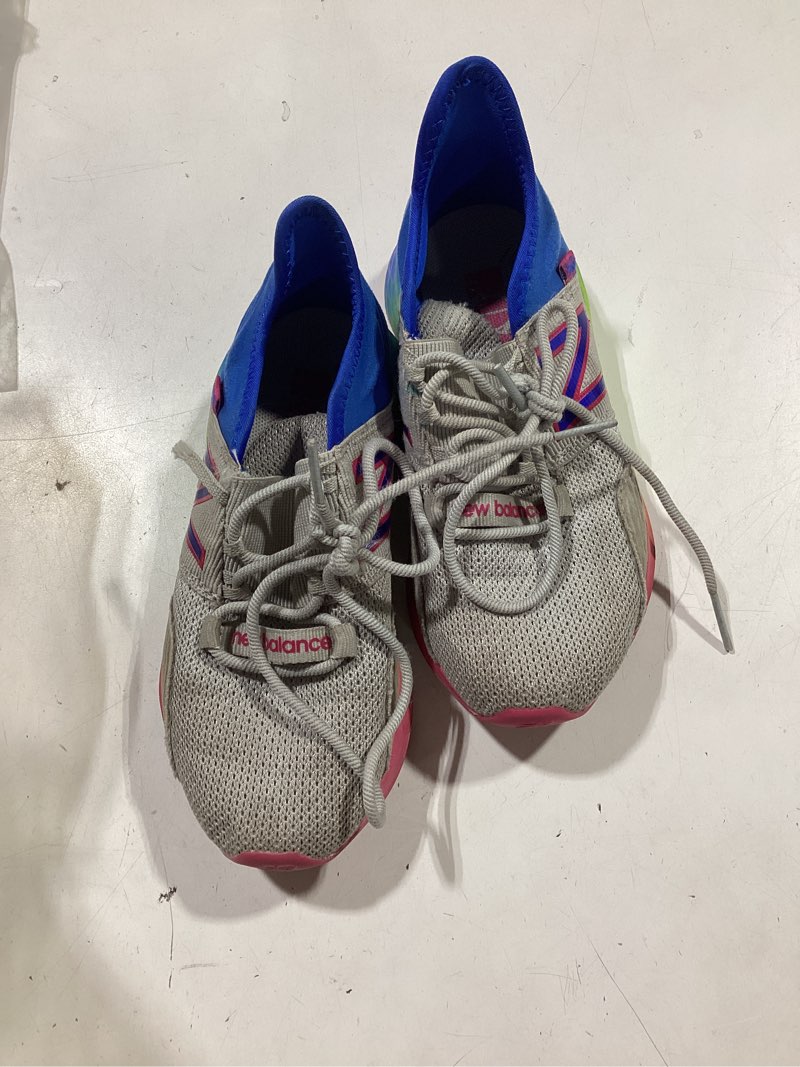 Condition photo showing As Is for new balance kids' fresh foam roav v1 lace-up sneaker light aluminum/cobalt 11 little kid