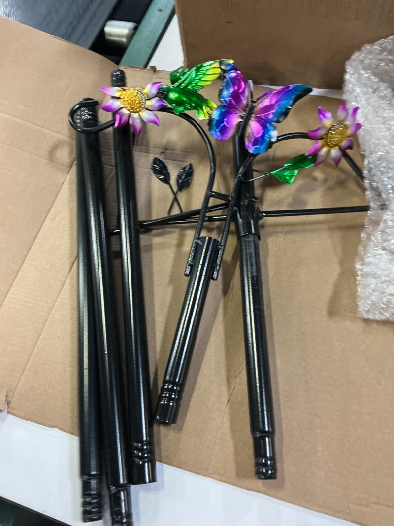 Condition photo showing As Is for double shepherds hooks for outdoor, artistic hummingbird & flower design, 5 - prong base, ideal for bird feeders, baskets & lanterns (1 pack)