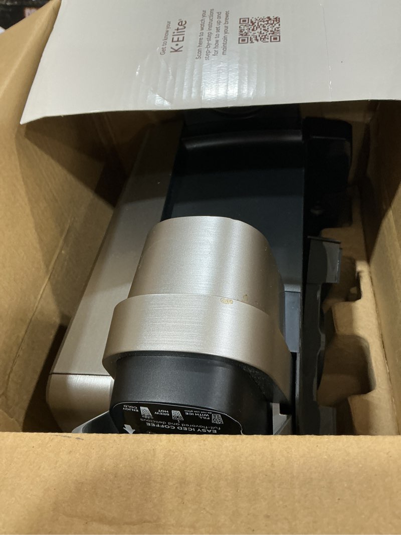 Condition photo showing As Is for keurig k-elite single serve k-cup pod coffee maker, with strength and temperature control, iced coffee capability, 8 to 12oz brew size, programmable, brushed silver