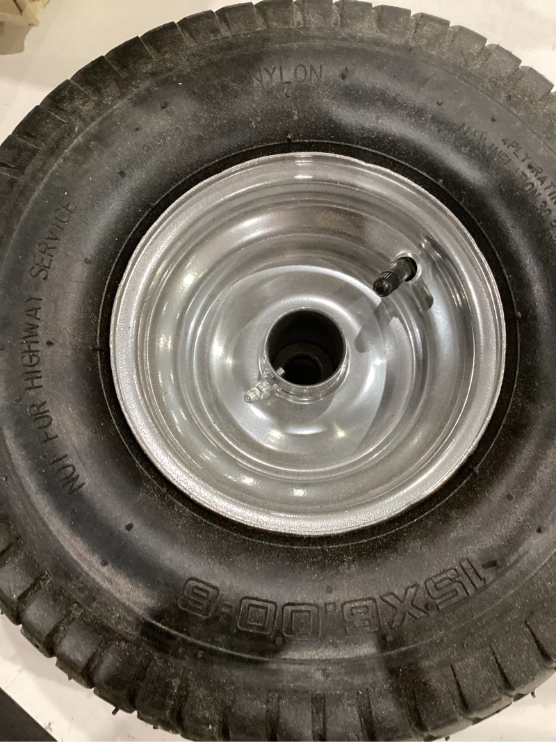 Condition photo showing As Is for briggs & stratton genuine murray briggs & stratton front wheel assembly