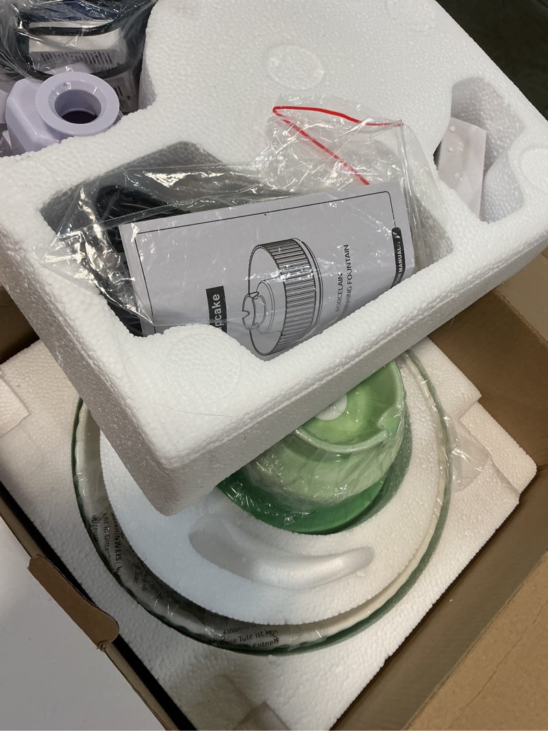 Condition photo showing Good Condition for lawfery ceramic cat water fountain, 2.1l/71oz cat fountain with 3 carbon filters and 2 water pumps, cupcake pet water fountain for cats and dogs (green)