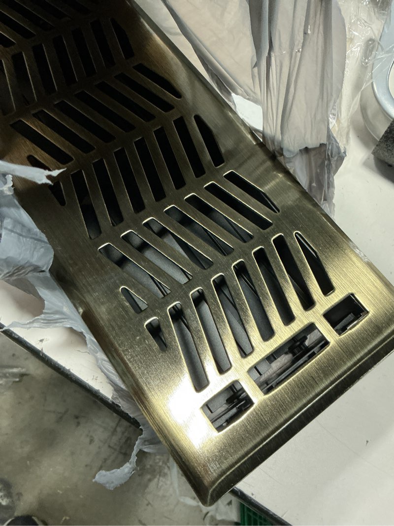 Condition photo showing As Is for allen + roth 4-in x 12-in maximum airflow steel antique brass clifton design floor register