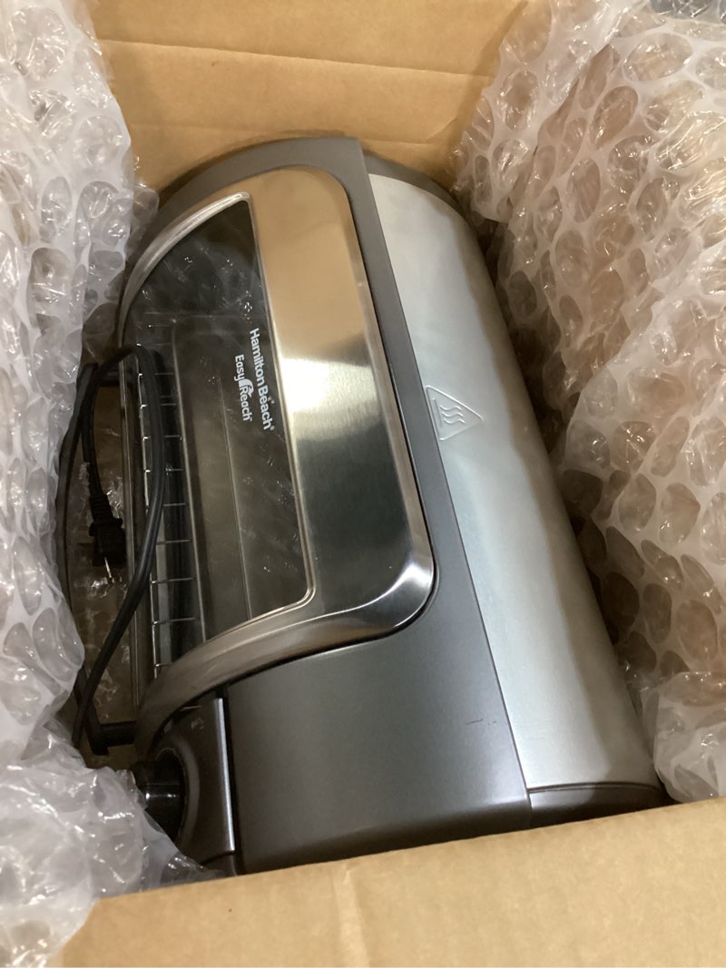 Condition photo showing Good Condition for hamilton beach easy reach 4-slice countertop toaster oven with roll-top door, 1200 watts, fits 9” pizza, 3 cooking functions for bake, broil and toast, silver (31344da) silver 4-slice