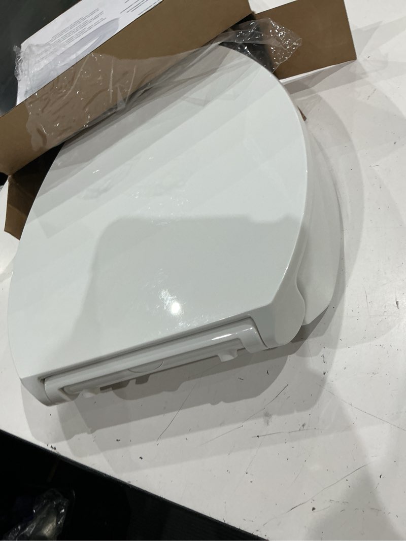 Condition photo showing As Is for kohler 25875-0 hyten 3" height, elevated soft close elongated toilet seat, contoured seat with grip-tight bumpers, quick-attach hardware, no slam toilet seat, white white elongated