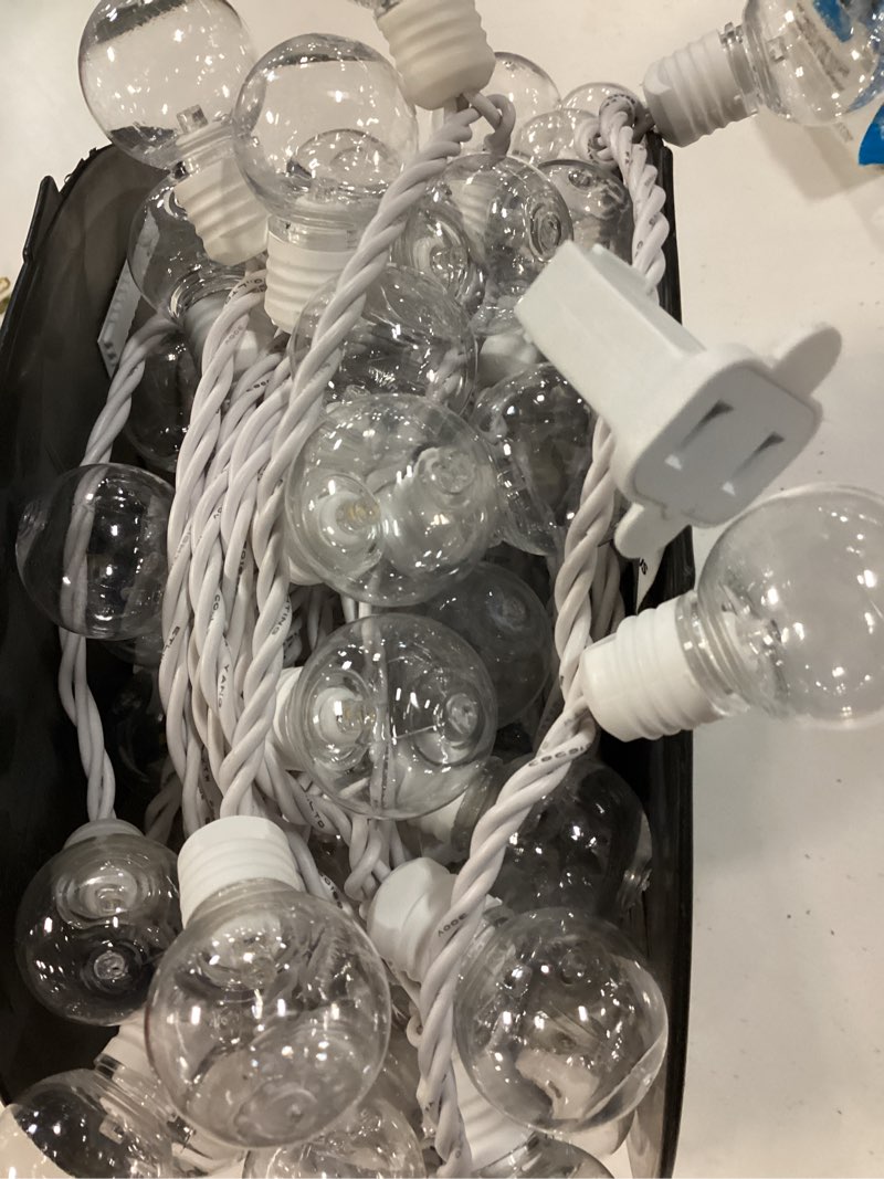 Condition photo showing As Is for harbor breeze 48-ft plug-in white indoor/outdoor string light with 100 white -light led globe bulbs