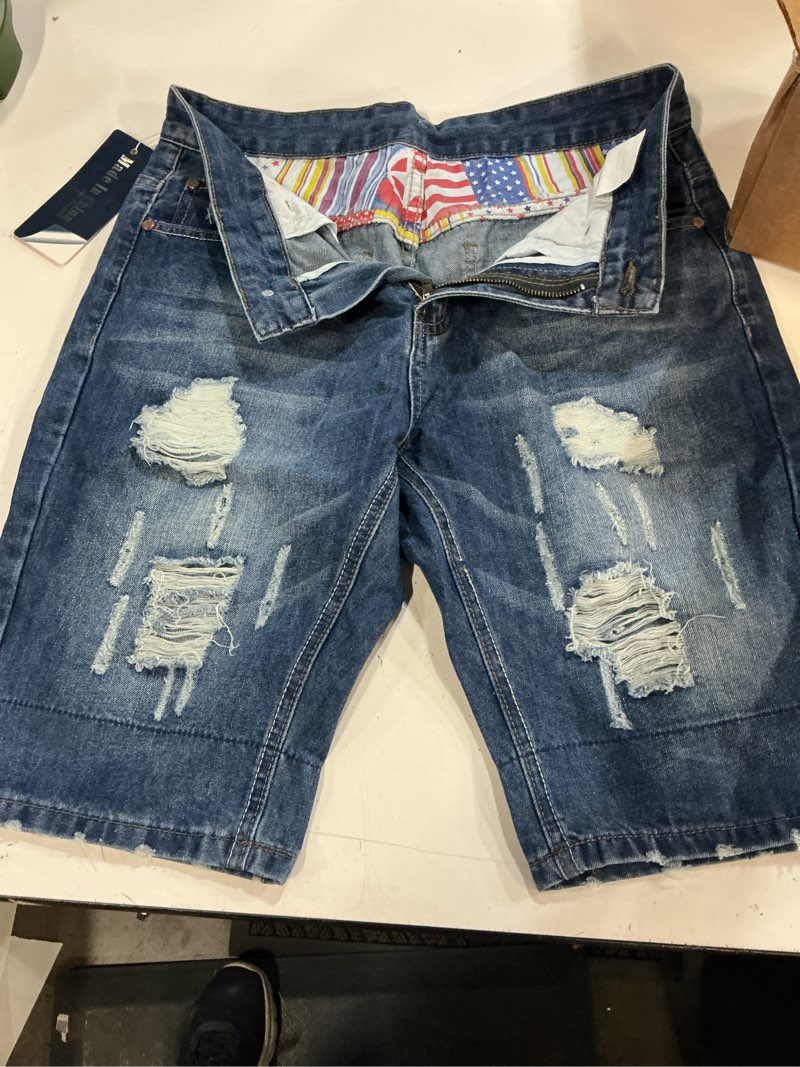 Condition photo showing New/Like New for fashion distressed denim shorts size 32