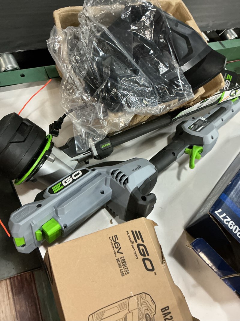 Condition photo showing As Is for ego power + powerload with line iq 56-volt 16-in telescopic shaft battery string trimmer 4.0 ah (battery included) (charger included
