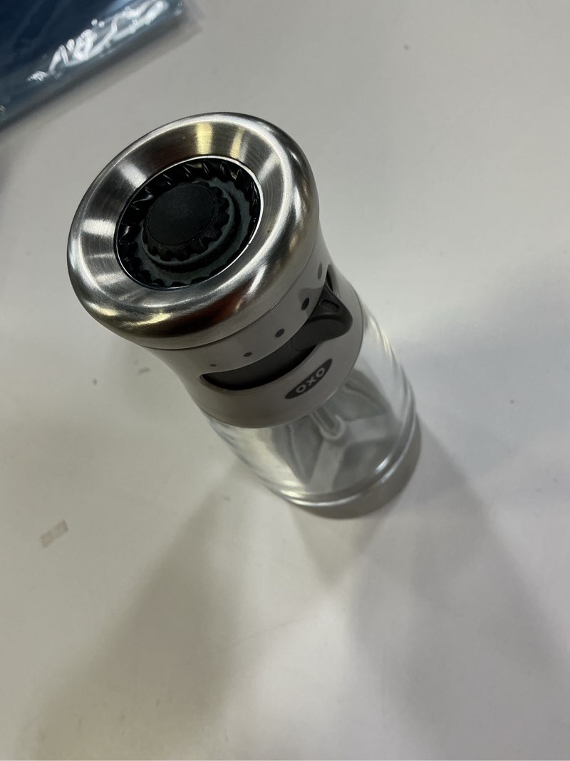 Condition photo showing Good Condition for OXO Good Grips Contoured Mess-Free Pepper Grinder, Adjustable Ceramic Grinder with Five Settings, Black Pepper Mill for Home and Kitchen, Spice Tool and Kitchen Gadget Pepper Grinder Gray