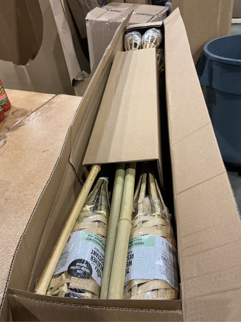 Condition photo showing New/Like New for tiki brand homespun outdoor torch  natural  pack of 12