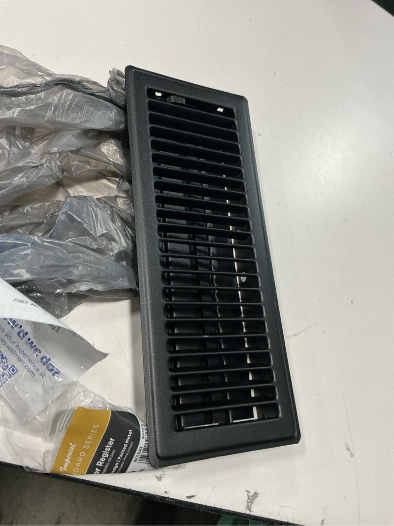 Condition photo showing As Is for imperial 4-inch x 12-inch matte black steel painted louvered, floor register, rectangular, household vent covers