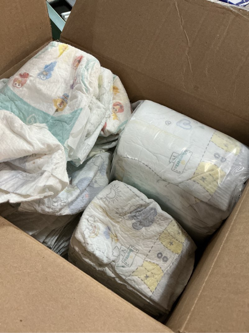 Condition photo showing As Is for pampers swaddlers diapers, size 0 (up to 10 lbs), 140 count, absorbent, keeps baby dry and comfortable, skin safe disposable baby diaper (packaging may vary) newborn 140