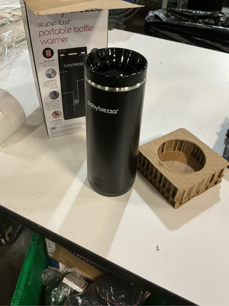 Condition photo showing New/Like New for baby brezza portable warmer – 3x faster baby bottle warming - travel breastmilk and formula warmer - safe, even heating - up to 9oz - no adapters, black