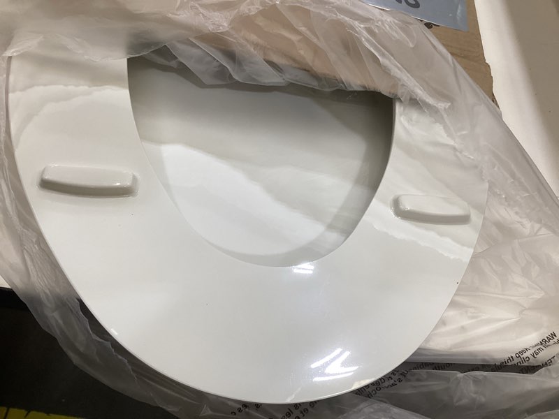 Condition photo showing As Is for bemis 7800tdg commercial closed front plastic toilet seat, heavy duty industrial seat with lid, secure installation for long lasting hospitality use, elongated, white elongated white