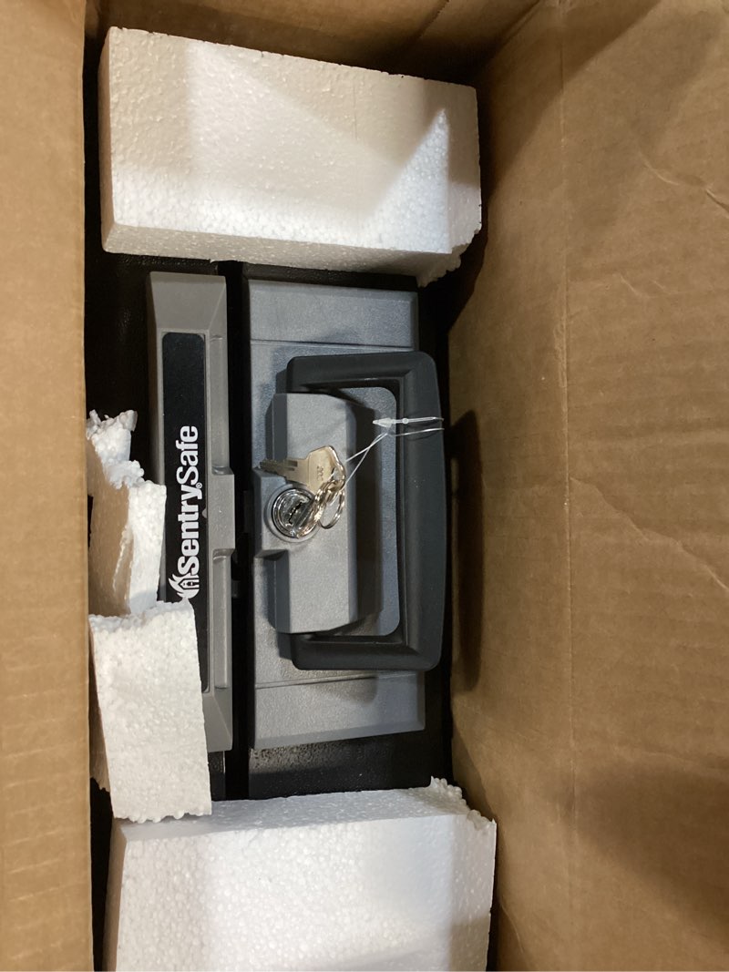 Condition photo showing Good Condition for SentrySafe Fireproof Safe Box with Key Lock, Chest Safe with Carrying Handle to Secure Money, Jewelry, Documents, 0.25 Cubic Feet, 6.3 x 15.3 x 12.1 Inches, 1160 Fire resistant box 0.25 cu. ft.