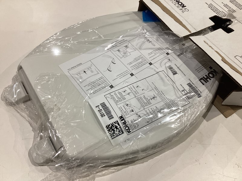 Condition photo showing As Is for kohler k-20110-0 brevia elongated toilet seat with grip-tight bumpers, quiet-close seat, quick-attach hardware, white