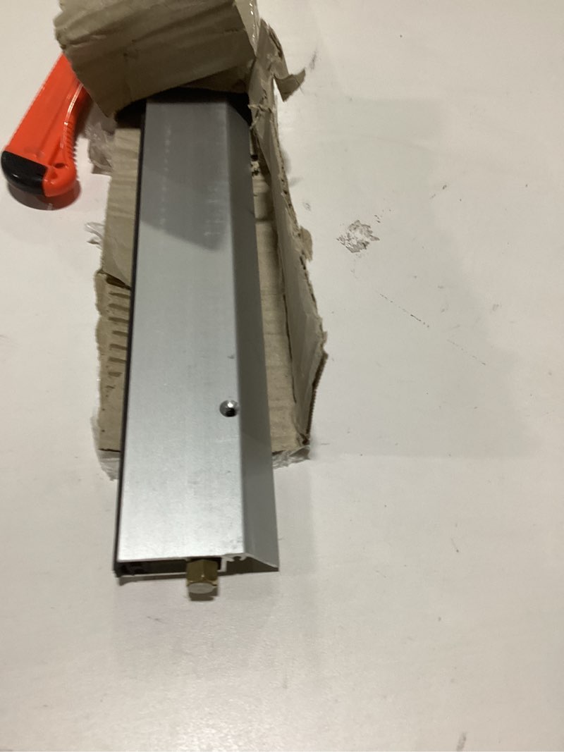 Condition photo showing As Is for Fire Rated/Light Duty/Surface Mounted Automatic Door Bottom (7123CA) with Solid Rubber Extrusion, SMS # 6 x 1'' Supplied, (36'' L x 19/32" W x 2" H)