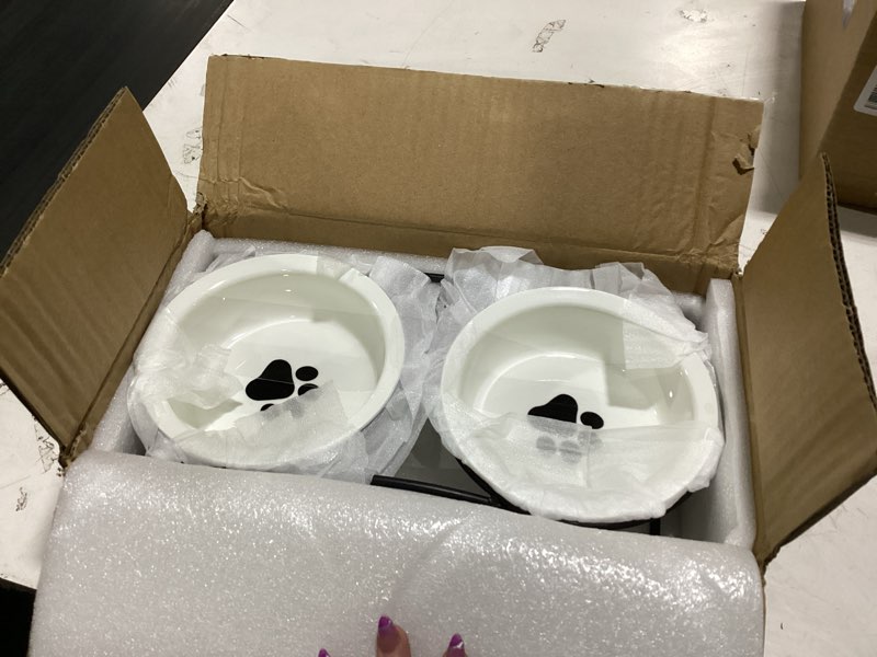 Condition photo showing New/Like New for cat & dog bowls - ceramic elevated pet raised cat food bowls, 12 ounce, dishwasher safe 2 paw pattern bowls & black stand