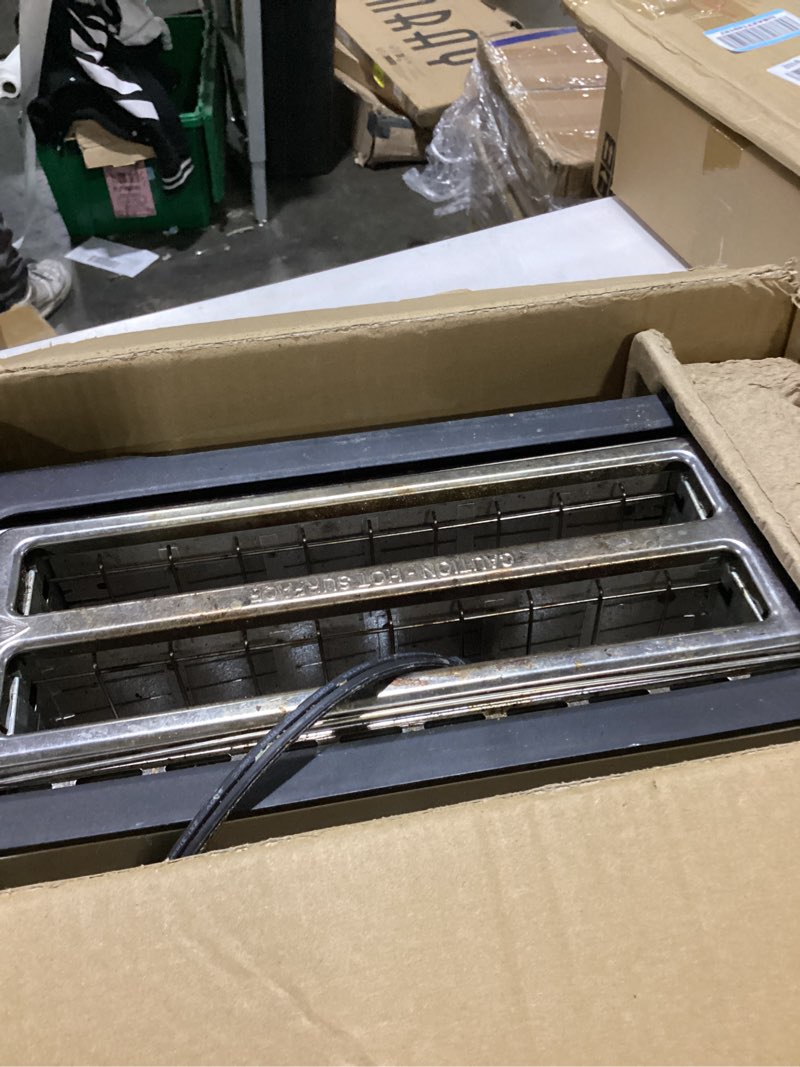 Condition photo showing As Is for elite gourmet ect-3100 4-slice long slot toaster | extra wide slots for bagels, sourdough & texas toast | 6 browning settings | reheat, defrost & cancel | built-in warming rack | stainless steel 4 slice black/stainless steel