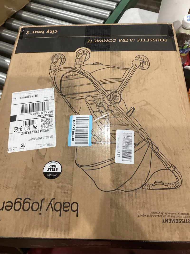 Condition photo showing As Is for Baby Jogger City Tour 2 Ultra-Compact Travel Stroller, Lightweight, Foldable, Pike Exclusive Includes Belly Bar, Leatherette Handlebar, and Premium Fabric