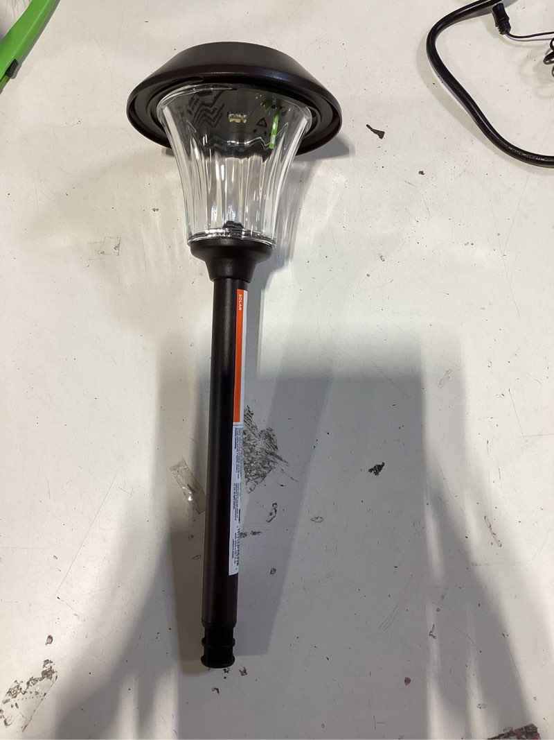 Condition photo showing As Is for harbor breeze 15 -lumens 0.15 -watt oil-rubbed bronze solar led outdoor path light ( 3000-k )