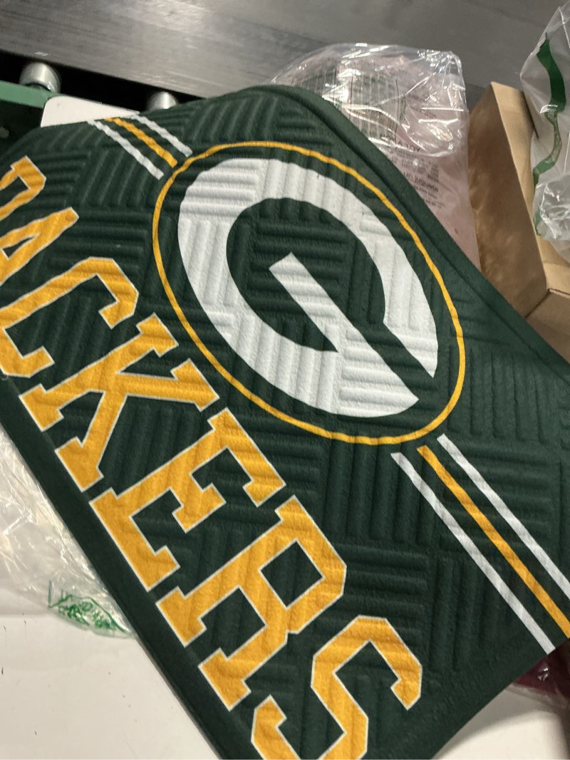 Condition photo showing New/Like New for Team Sports America NFL Entrance Doormat | 28 x 16 Inches | Embossed Cross Hatch | Non - Slip Backing | Indoor and Outdoor Home Décor (Green Bay Packers) Green Bay Packers-cross Hatch 1'4" x 2'4" (Rectangular)