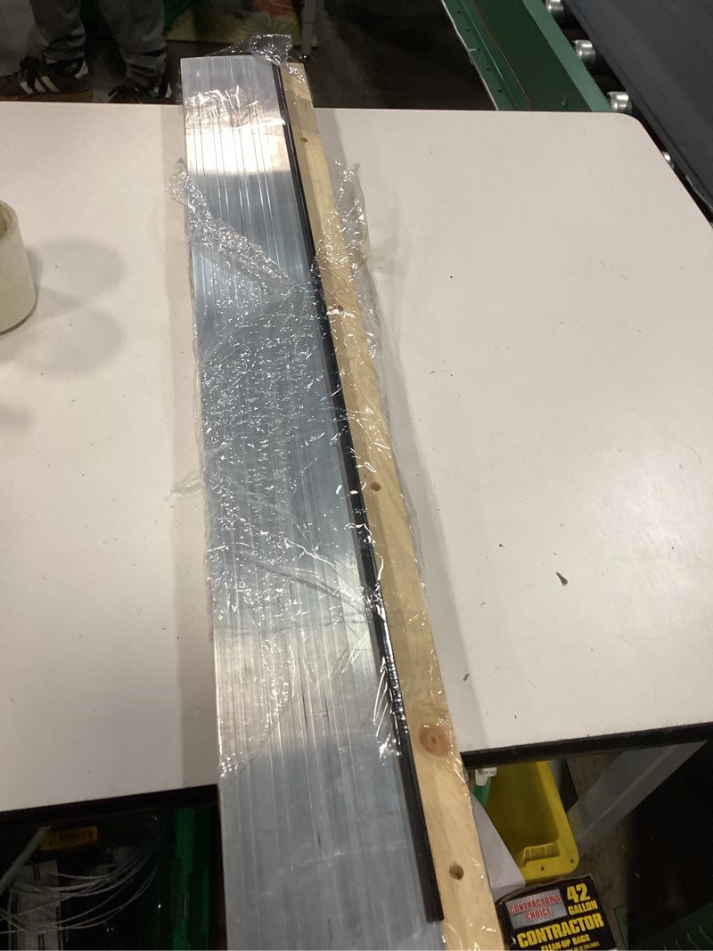 Condition photo showing As Is for m-d building products 1.13 in. h x 5.63 in. w x 36 in. l aluminum adjustable threshold oak