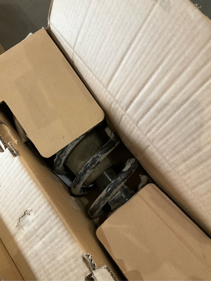 Condition photo showing As Is for monroe quick-strut 139104 suspension strut and coil spring assembly for chevrolet tahoe