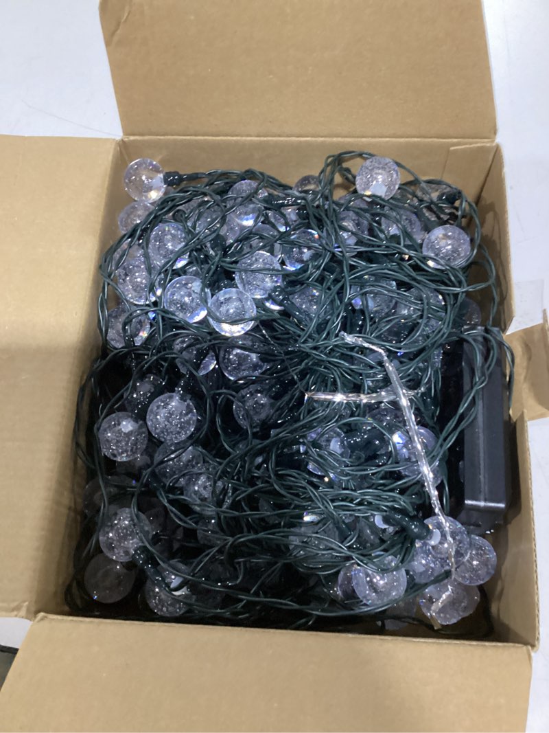 Condition photo showing As Is for usokyo solar lights outdoor waterproof, 2 pack total 120led 72ft solar string lights for outside with 8 modes, outdoor string lights crystal globe patio lights for garden yard party decor (green) green 2 pack-120led (total)