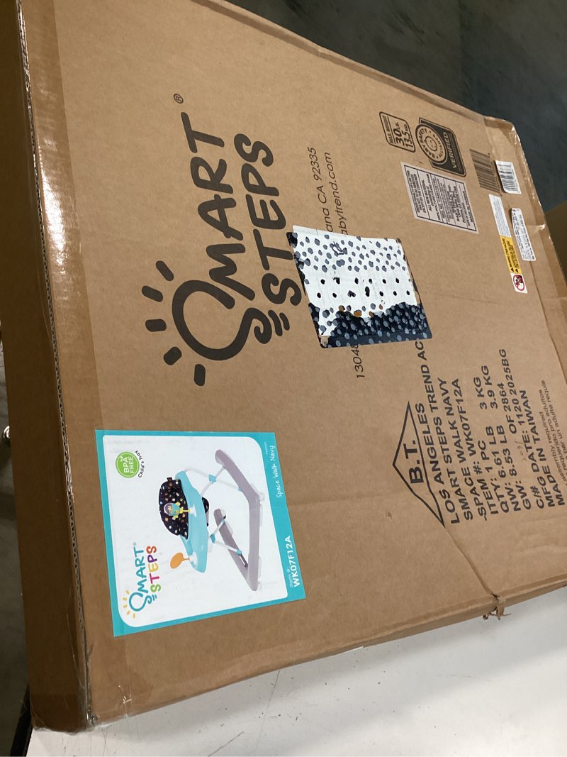 Condition photo showing New/Like New for smart steps trend activity walker and entertainer with removeable toys, large tray, cup holder, adjustable height and flat fold frame for storage, ages 6 months +, space walk navy