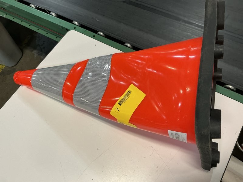 Condition photo showing As Is for 28-inch safety cone fluorescent orange pvc with black base base weight 3.6 lbs., total weight: 7.0 lbs handle grip