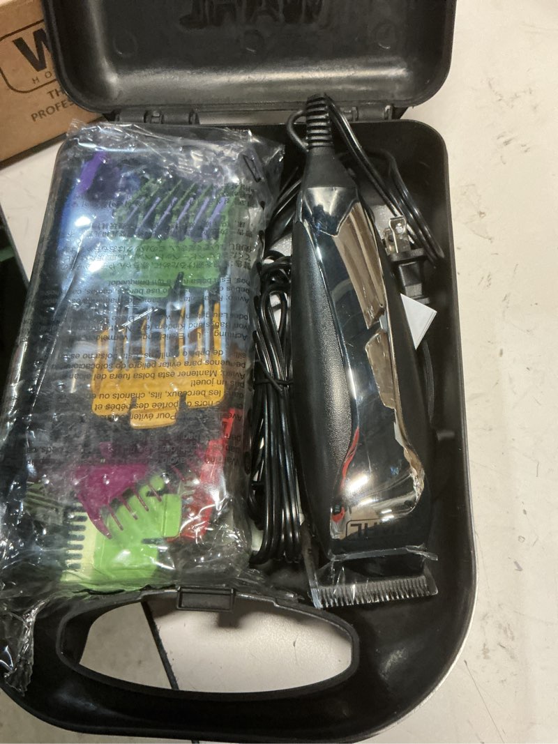 Condition photo showing New/Like New for wahl home haircutting corded clipper kit with adjustable taper lever, and 10 color coded guards for easy clipping & trimming - model 79722 20 piece set