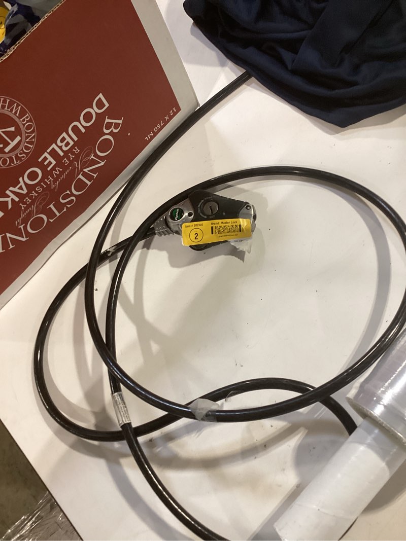 Condition photo showing As Is for master lock (8 ft.) contractor 96-in keyed cable lock