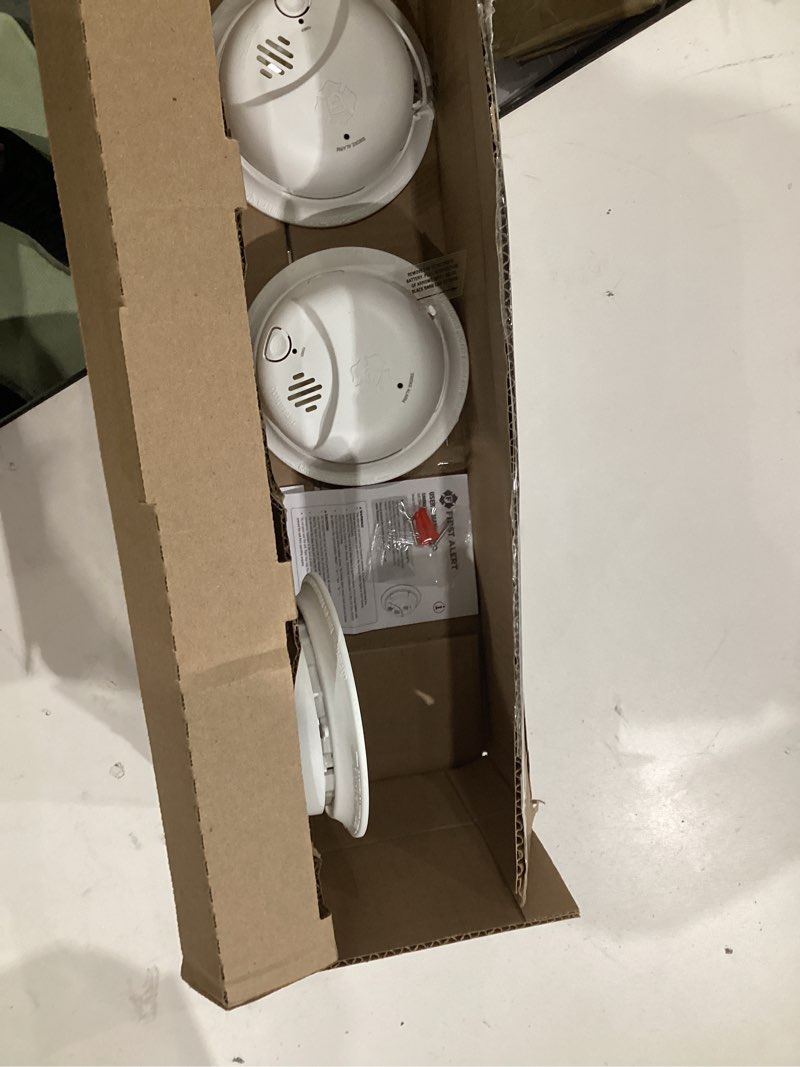 Condition photo showing New/Like New for first alert brk smoke alarm, interconnect hardwire detector with 10-year battery backup, smi105-ac, 3-pack precision detection smi105-ac 3-pack