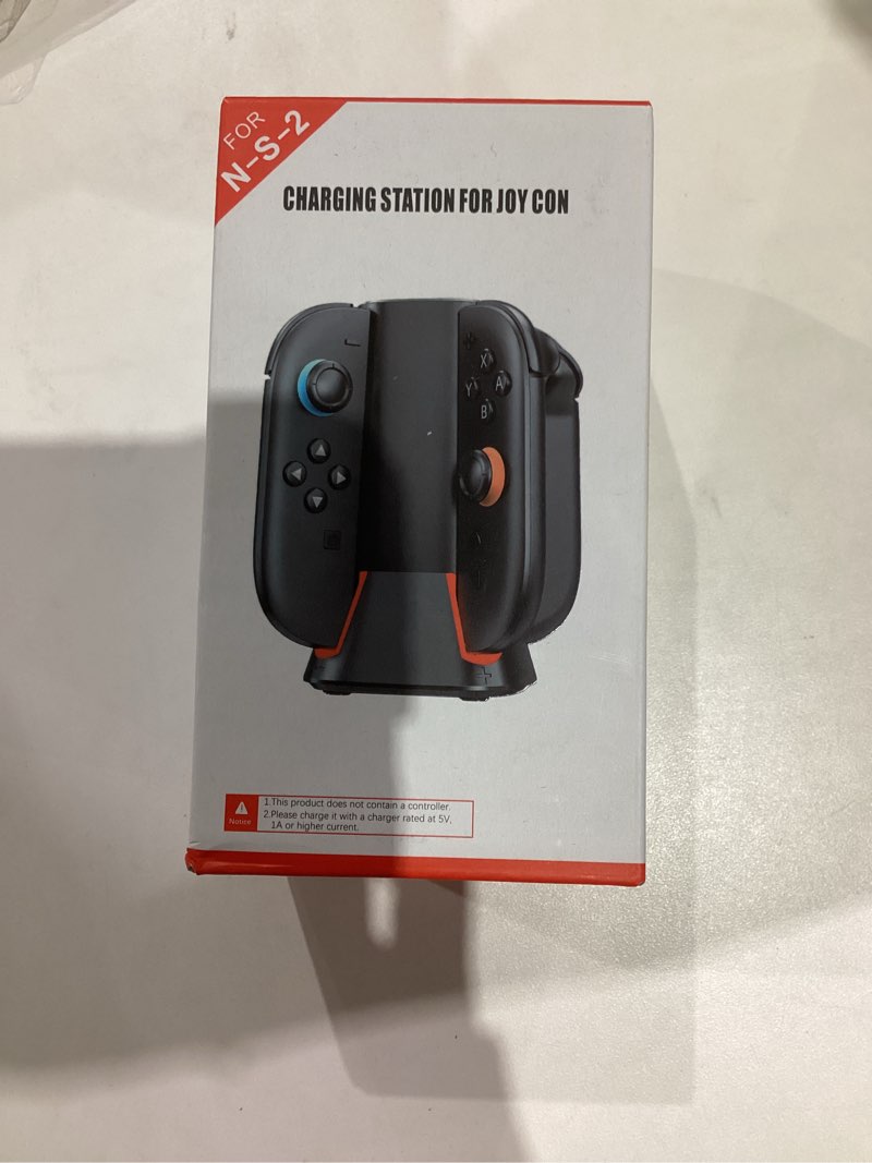 Condition photo showing New/Like New for Charging Dock for 2025 Nintendo Switch 2 JoyCon Controllers, 4-Slot Charger Station for Switch 2 Joy-Con Controllers, Magnetic & Weighted Base, LED Indicators, with USB-C Cable and 2 Wirst Strap