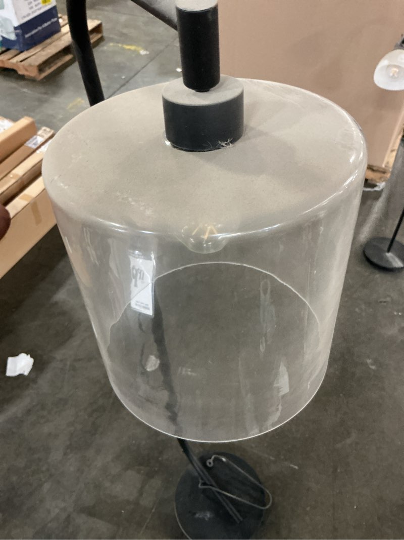 Condition photo showing As Is for cline 62.5 in. 1-light black floor lamp with clear glass lamp sh