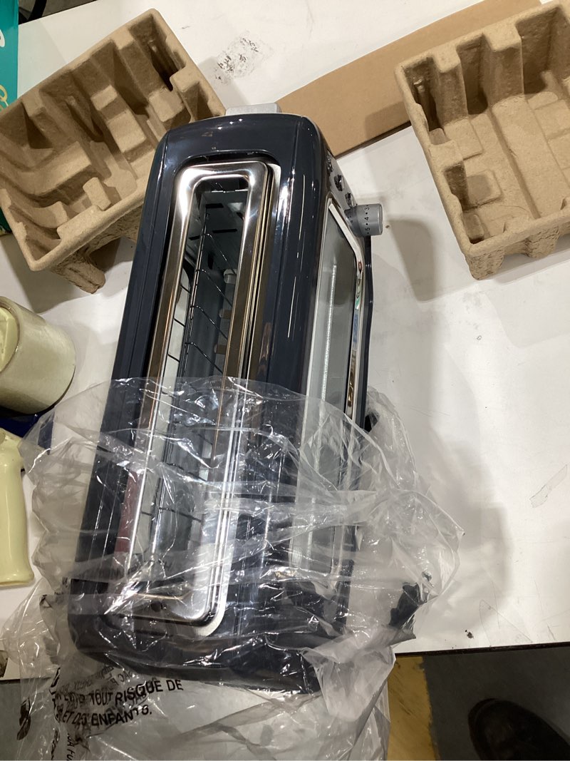 Condition photo showing New/Like New for DASH Clear View Toaster: Extra Wide Slot Toaster with See Through Window - Defrost, Reheat + Auto Shut Off Feature for Bagels, Specialty Breads & other Baked Goods - Grey Gray