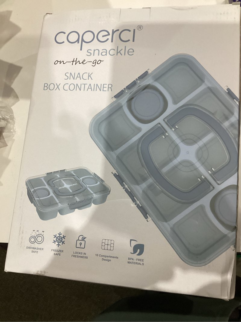 Condition photo showing New/Like New for Caperci Original Snackle Box Container - 10-Compartment Divided Snack Serving Tray with Lid & Handle, Built-in 2 Dressing Containers, Leak-Proof, Dishwasher Safe, BPA-Free (Sky Blue)