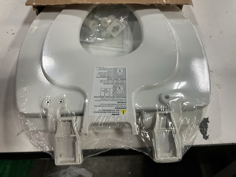 Condition photo showing New/Like New for mayfair nextstep toilet seat with built-in potty training seat, slow-close, removable that will never loosen, elongated, white elongated 2-in-1 toilet seat