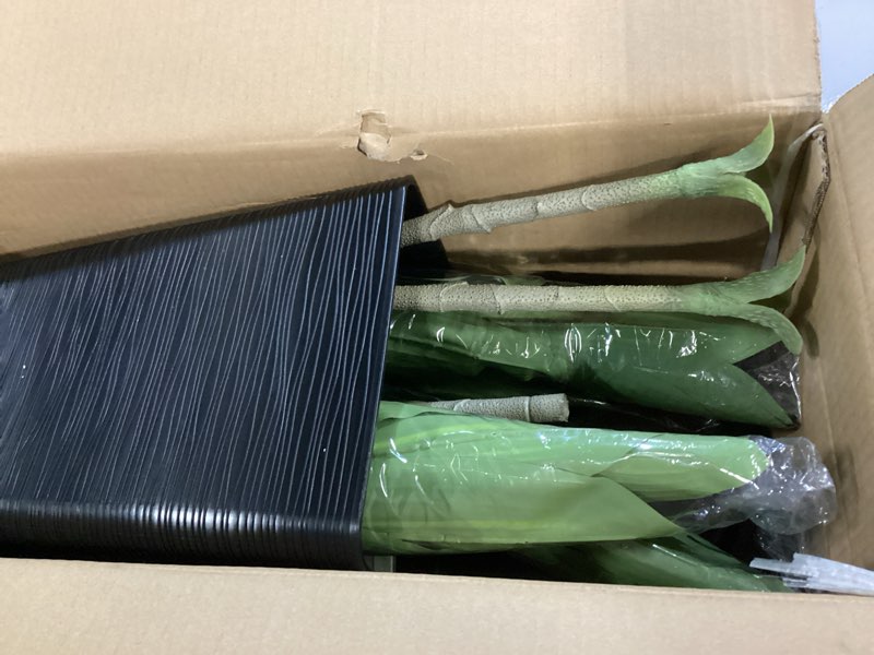 Condition photo showing item condition for 5FT Artificial Dracaena Tree with Black Planter and Fake Moss - Real Touch Fake Plant for Home & Office Decor, Faux Yucca Indoor Floor Tree, Low Maintenance, Non-Fading Silk Plants 5ft Black-5ft