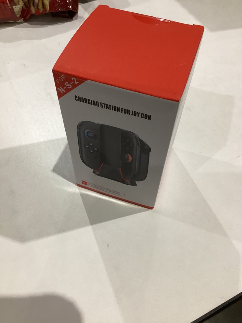 Condition photo showing New/Like New for Charging Dock for 2025 Nintendo Switch 2 JoyCon Controllers, 4-Slot Charger Station for Switch 2 Joy-Con Controllers, Magnetic & Weighted Base, LED Indicators, with USB-C Cable and 2 Wirst Strap