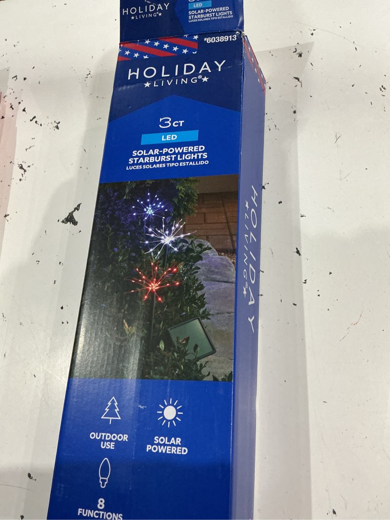 Condition photo showing As Is for holiday living 3-piece outdoor patriotic solar powered starburst pathway lights