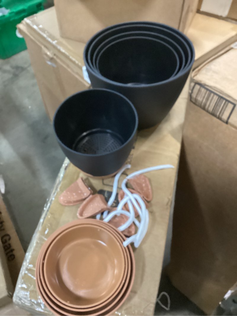 Condition photo showing As Is for indoor self watering planters with drainage holes and saucers, 8, 7, 6.5, 6, 5.5, 5 inches, black, 5 pots 8+7+6.5+6+5.5+5 inch black