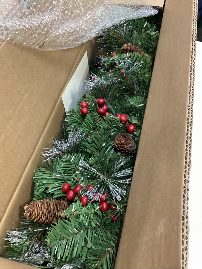Condition photo showing Good Condition for national tree company 9 ft pre-lit crestwood spruce artificial christmas garland, christmas decoration with glitter, pinecones, red berries, 50 clear lights, 180 tips, green plug in tree