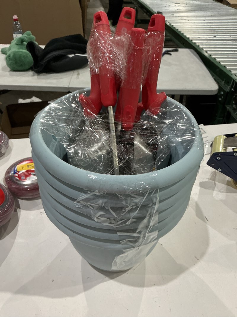 Condition photo showing As Is for flower pots with gardening tools